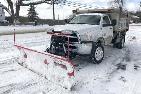Snow plowing and salt spreader services for homes and commercial businesses